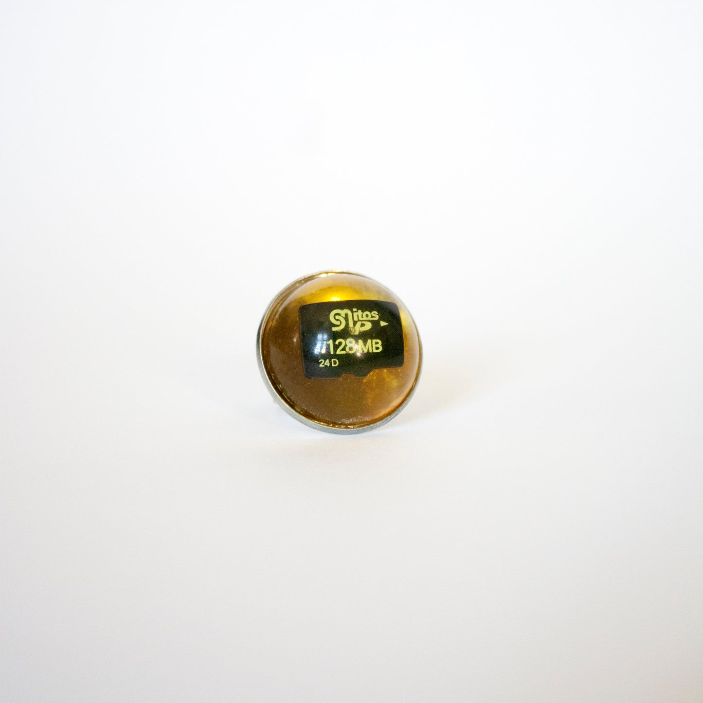 RING WITH A MEMORY CARD AND FILE IN AMBER RESIN. (DO NOT OPEN!)